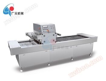 Continuous vacuum skin packaging machine
